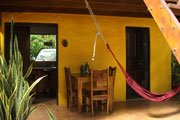 Cabin dining patio at Howler Monkey Hotel