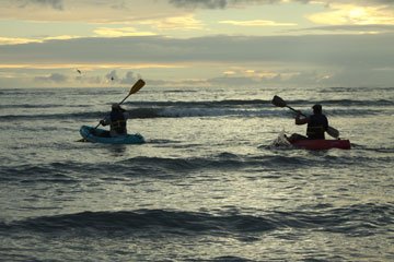 image of guests going fishing in kayaks at Howler Monkey Hotel